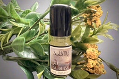 Muse Fragrances by SugarMuses® nestled in a small black box packed with organic moss and other botanicals.
