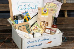 A busting box to showcase the state of North Carolina. This box included locally made food items, and an insulated drinking cup.