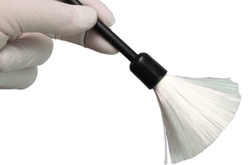 We see a basic latent fingerprint kit with brush powder and tape to lift latent fingerprints from surfaces
