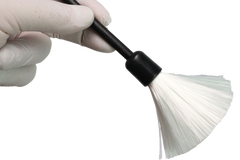 We see a basic latent fingerprint kit with brush powder and tape to lift latent fingerprints from surfaces