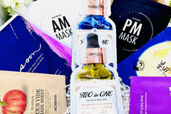 a display in a gift box of several different premium sheet masks with each mask shown in a circular pattern