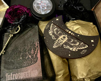 A beautifully packaged Busy Witch Box offering with gold metallic tissue, botanicals and velvet talisman bag. Includes a dried rose & key.