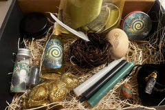A Busy Witch Box featuring Ostara Sabbat Ritual items, including candles, ritual salt, hare, amethyst & ritual oil in a subscription