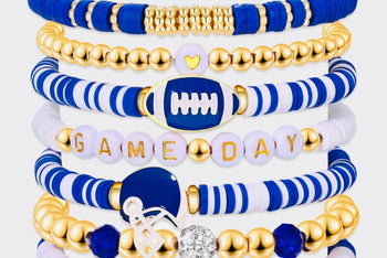 Game Day 8-piece stackable friendship bracelet set shown as a tall stack in blue, white, and gold CZ beads with football, helmet, and GAME D
