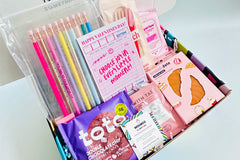 Colorful TEEN WISHBOX subscription box filled with skincare, socks, and snacks, ideal as a holiday gift for teens
