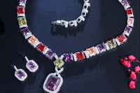 This photo represents a multi color, multi gemstone jewelry set which included earrings, one big statement necklace, one bracelet and ring