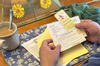 A letter, cartoon, cookie recipe and curated suprise are included in each month's Knit Snail Mail Club membership.