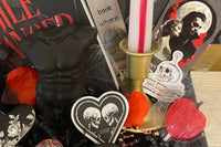 This deliciously dark book box includes a mix of dark romance & Halloween erotic horror books + a themed merch by Gothika Books.