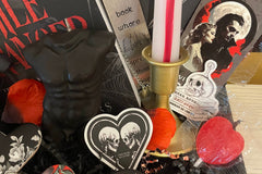 This deliciously dark book box includes a mix of dark romance & Halloween erotic horror books + a themed merch by Gothika Books.