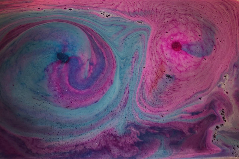 Bombs and Bubbles bath bomb fizzing in water