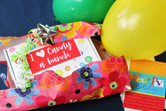 Give the I heart Candy a bunch box as a gift for any occasion.  Box shown here with balloons and wrapping paper. 