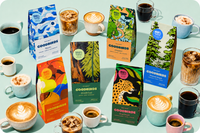 multiple bags of coffee and cups of coffee, part of Goodbirds monthly coffee subscription of 2 12oz bags of coffee