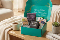 Open Senior Joy Box subscription box featuring snacks, a candle, and socks for aging parents on a cozy table setting