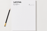 Let It Out notepad with a dotted grid page and a date line for no-filter journaling, shown with a black pencil