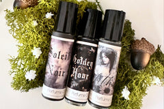Muse Fragrances by SugarMuses® nestled in a small black box packed with organic moss and other botanicals.