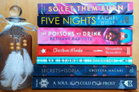Pile of our chosen books of the month displayed on top of eachother showing the spines , this shows the kind of books we choose 