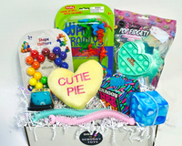 Dinosaur Wally Crawlys, Shape Shifters, Plush Coversation Hearts, esPop Fidgety Pop It, Needoh Stress Ball, squish cat, bubble pop