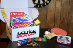 I heart candy a bunch box is perfect for everyone.  Box is shown here open with all the sweet treats in a recreational room. 