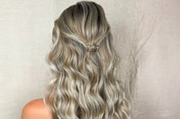a gold crown shaped barette used in a loose casual twisted half up style on blonde hair as an example of our barettes