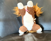 Showing Snorri's stomach. Her white paws, white belly and brown legs. You can also see her fluffy ears. 