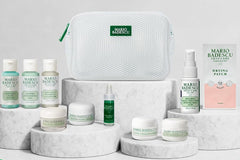 Beautiful photo of different green skin care products from a very popular premium brand. Laying on a stone like pedestals