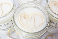 Each candle in our Signature Collection is crafted with our logo embedded in the wax for an added touch of luxury.