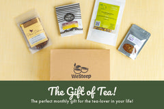Loose leaf tea pouches surround the WeSteep Monthly Box, which makes a great gift for any tea lover in your life!
