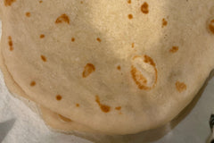 This image shows Pita Bread that has been baked using Risen Sourdough Starter Co.'s Starter. We added it to our baked goods !