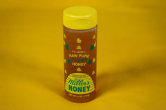 Small honey bottle included in the Bee Kind Appreciation Box, a sweet symbol of kindness, teamwork, and thoughtful appreciation gifts.