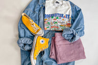 a teen grunge outfit consisting of chucks, a bright colored pant, vintage t-shirt and denim overshirt to match