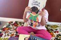 Child reading picture book