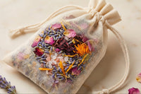 Herbal bath sachet filled with colorful botanicals lavender rose petals calendula and Alaea sea salt