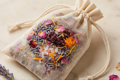 Herbal bath sachet filled with colorful botanicals lavender rose petals calendula and Alaea sea salt