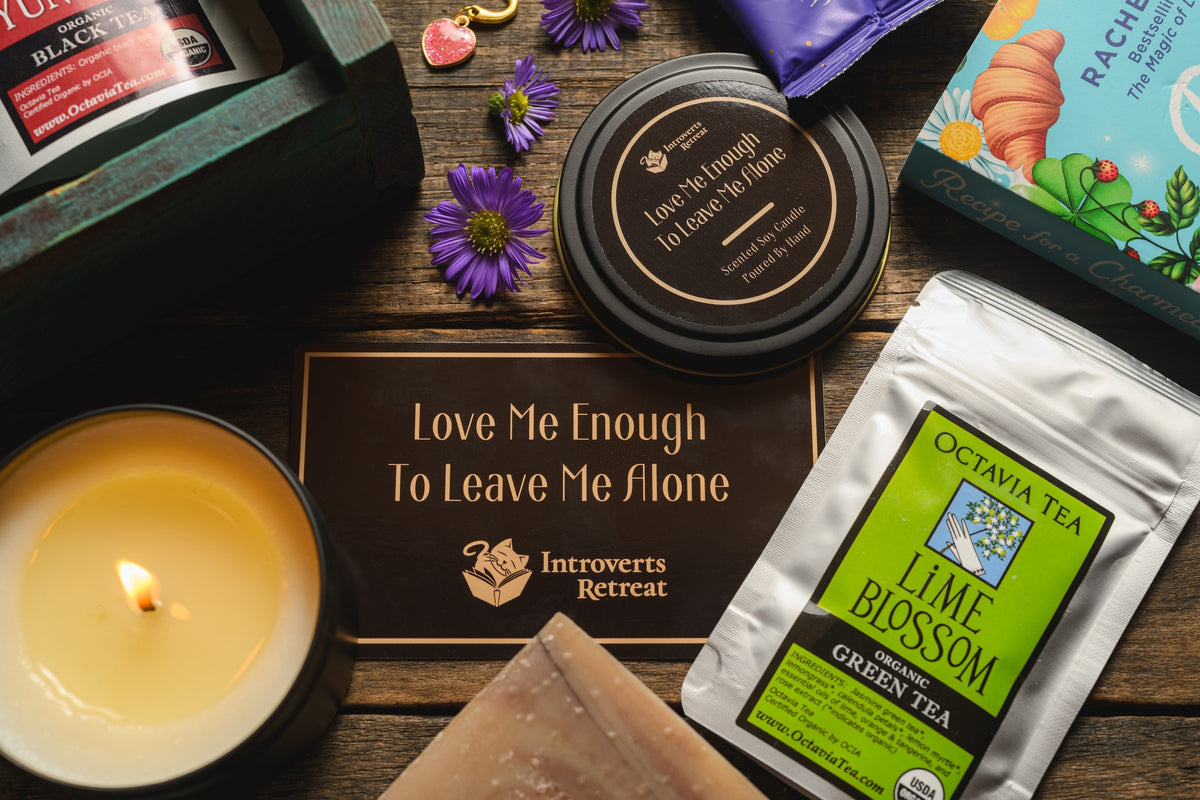 Introverts Retreat box image of a box with bath salt soaks, tea and candle plus a book on the side plus flowers.
