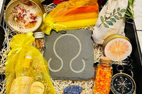 Litha Sabbat ritual box from Busy Witch Box featuring candles, anointing oil, incense, and ritual salt in a decorative arrangement