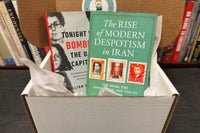 An example box containing two books valued at over $50 retail price, carefully packaged in a Bradley's Book Box.
