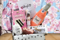 An open Mystic Pup subscription box filled with natural dog treats and fun dog toys plus self care/spiritual items for you.