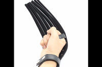 A leather whip that attaches to the hand, from a Kink Crate subscription box.