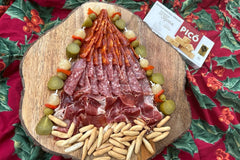 This Charcuterie tree is an example of what you can do with your Merry Tapas Box full of Iberico flavor, sweet pickle banderillas and turron