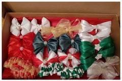 A previous Christmas box featuring red, gold, green, and white with pearl and snowflake embellishments. Holiday hair bows!