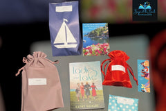 September box featuring Ladies of the Lake along with 5 gifts to unwrap!                                 