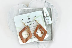 Diamond Wood Cutout Earrings with Gold Leaf Dangles in White Gift Box with Aromatherapy Instruction Card and Rise + Shine Mini Oil Dropper.