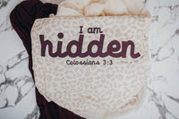 The powerful word "Hidden," drawn from the verse Colossians 3:3, which states, "For you died, and your life is now hidden with Christ."