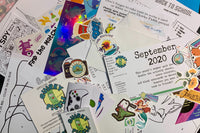 Pic shows actual contents of a Quirky Pickle pack from September 2020. There are stickers, cards, activities, and more.