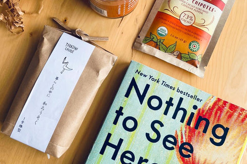 Sample box: Nothing to See Here by Kevin Wilson about twins who spontaneously catch on fire, with candles, spices, and spicy chocolate.