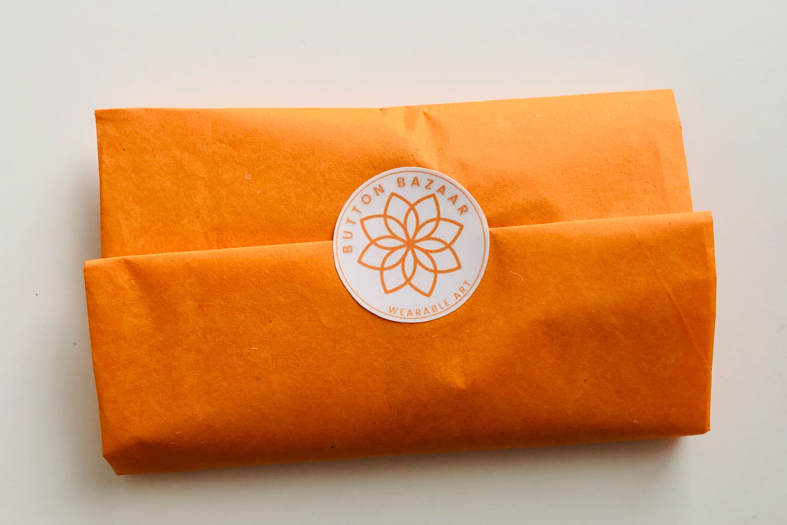 Every shipment of buttons is packaged  in a handmade pouch and gift-wrapped in tissue paper to make gift-giving easy!