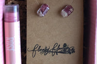 Featured in this picture are a pair of earrings made with stainless steel and Peony flowers, and 1 Rosé flavored chap stick. 