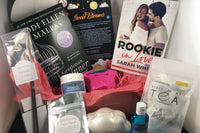 Bubbles & Books subscription box featuring a romantic novel, handmade soap, and bath products for relaxation