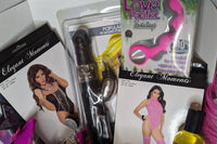 Another image of adult goodie box with anal beads, lingerie, body oil, rabbit vibrator, & vibrating underwear.