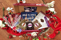 Spice Madam Monthly Subscription box featuring spice packets and recipe cards surrounded by illustrated food items